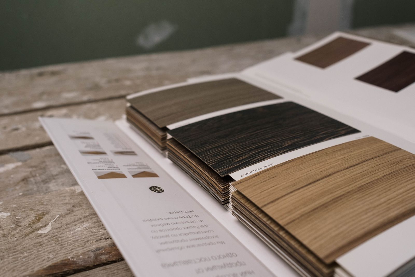 Wood flooring sample swatches fanned out on a showroom table