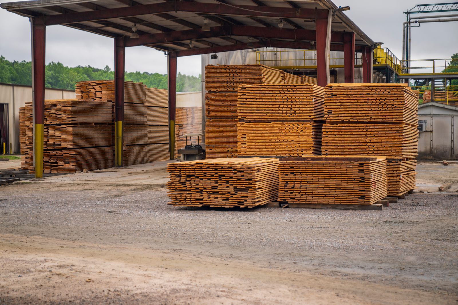 Stacks of dimensional lumber stored in a lumber yard